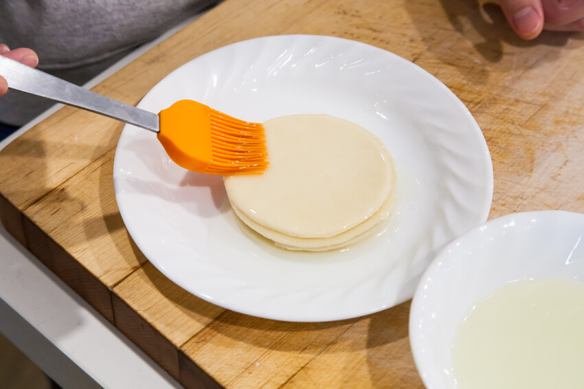 Brushing oil on pancakes