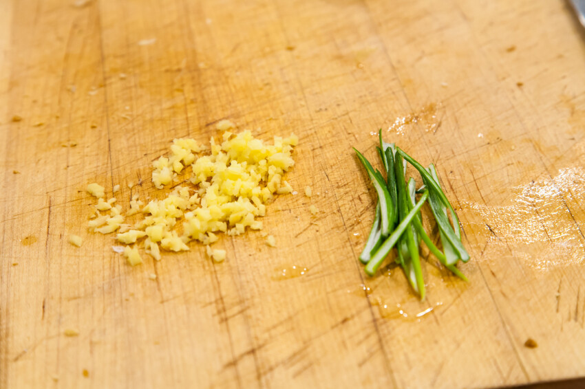 Chopped green onions and minced ginger